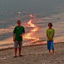 Kuba and Jay on burning Shuswap Lake at sunset